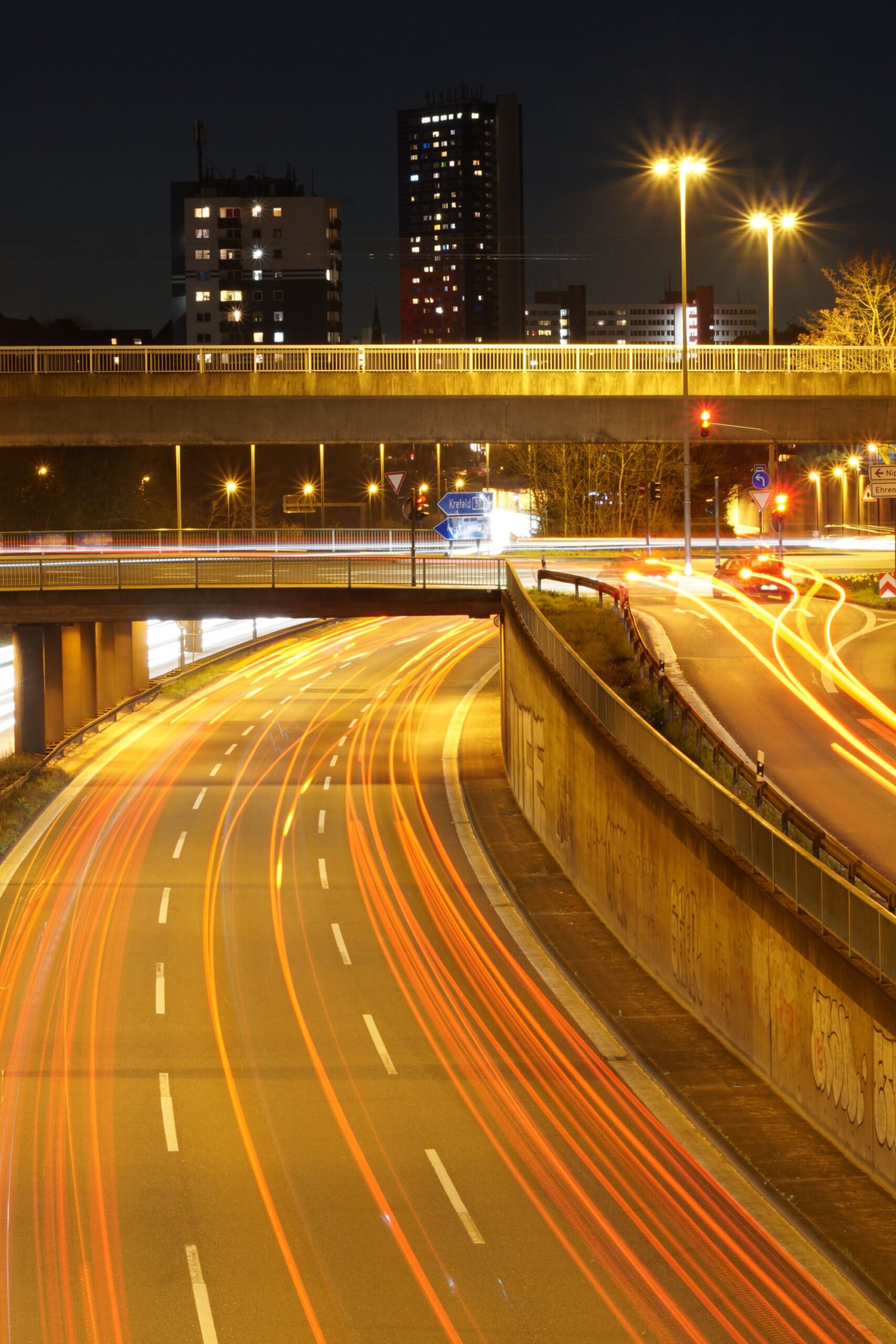 vertical-high-angle-shot-illuminated-highway-night